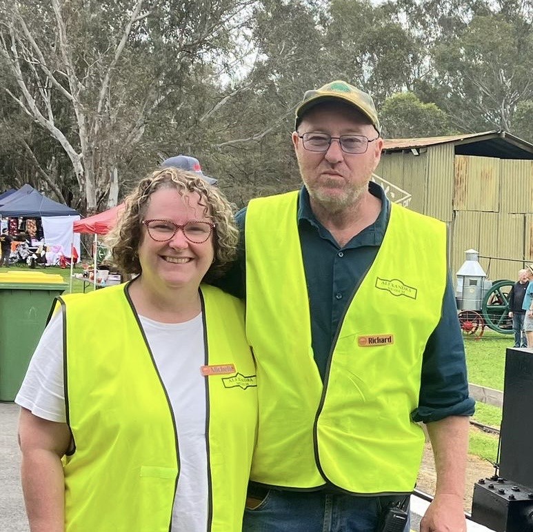 Two ATTM volunteers in high-visibility vests on an operating day